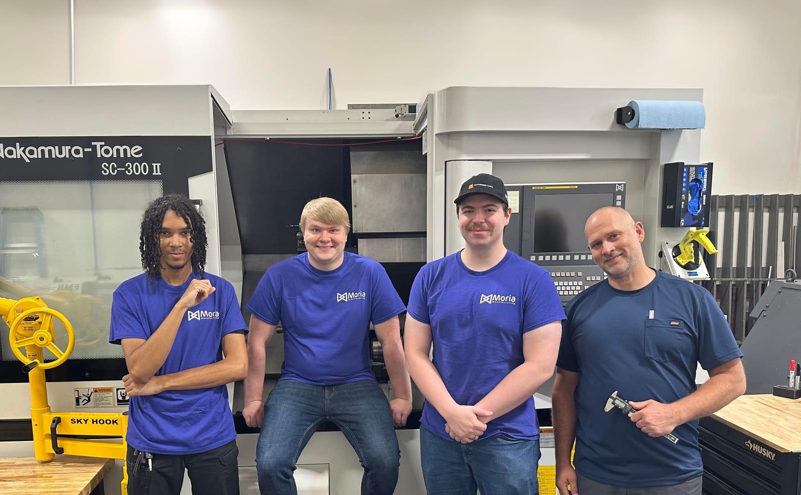 Moria Manufacturing team in front of a Nakamura-Tome SC-300 II